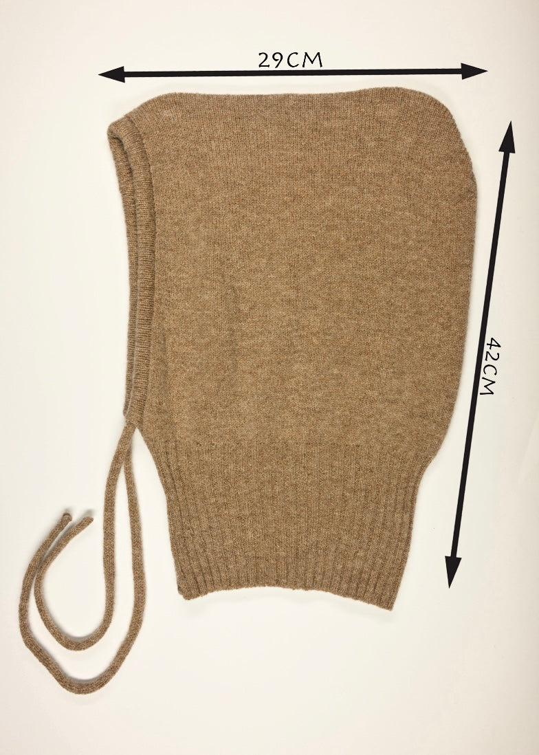 A flay lay of our cashmere knitted balalcava in tan on a white background displaying the measurements of 29cm wide by 42cm