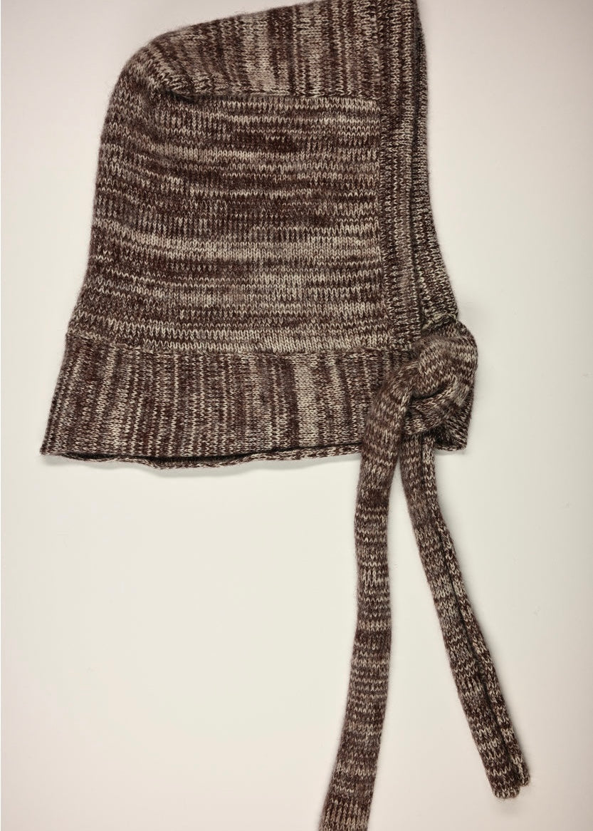 Knitted burgundy scarf on a light background