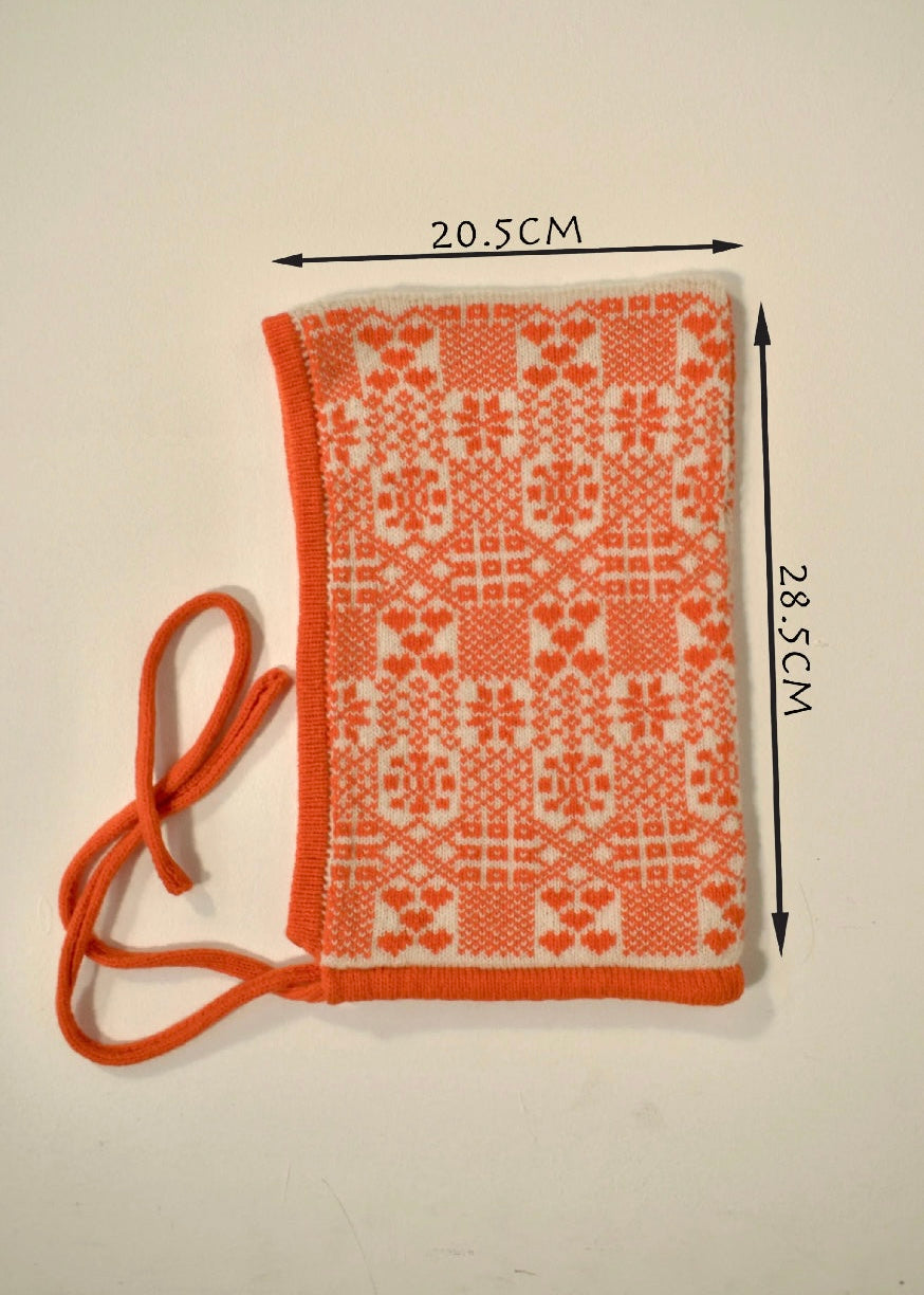 with orange strap and patterned design, measured on a plain background