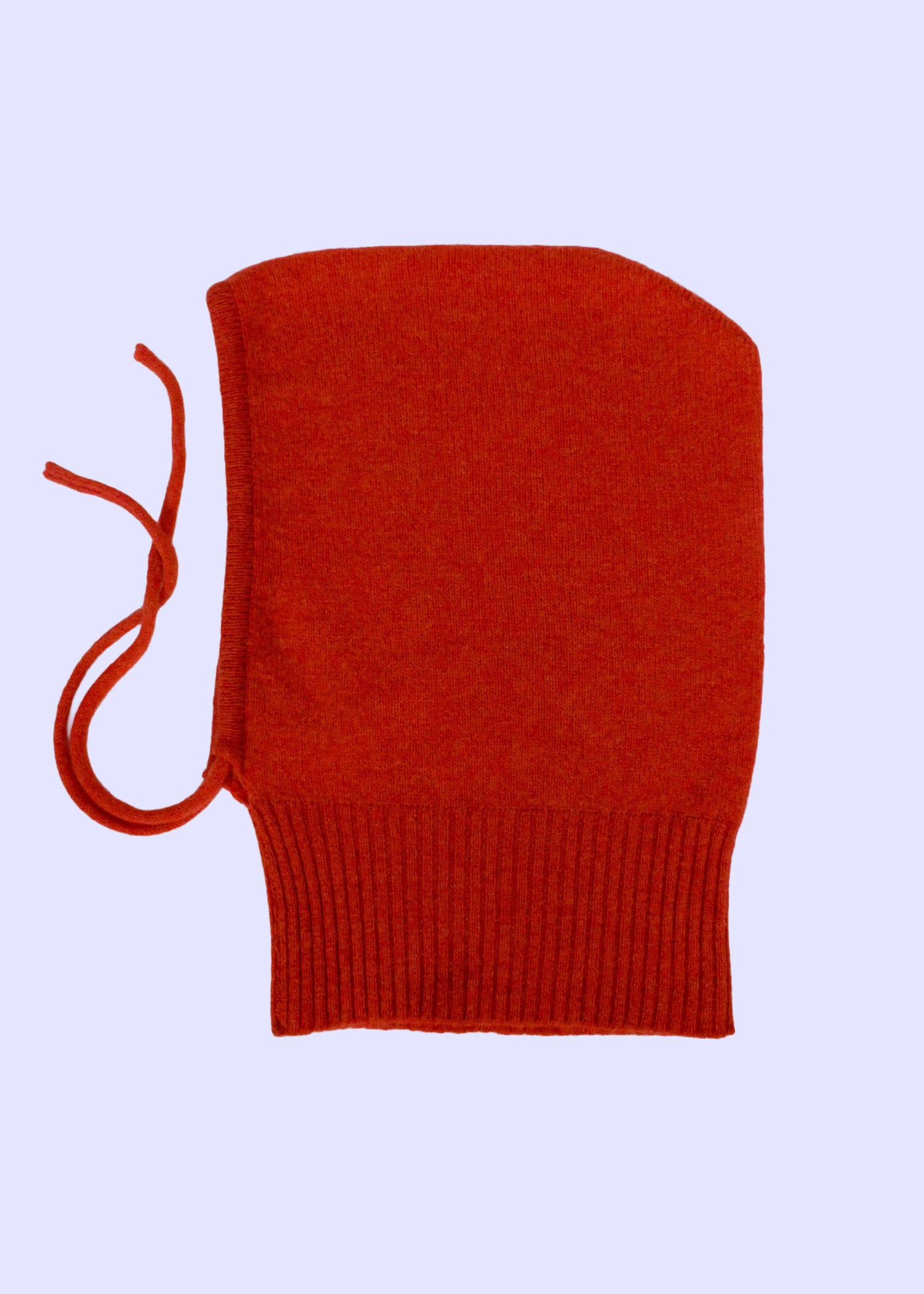 orange knitted balaclava with a drawstring on a light blue background