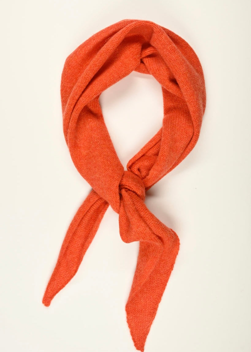 Orange neckerchief scarf tied neatly on a white background
