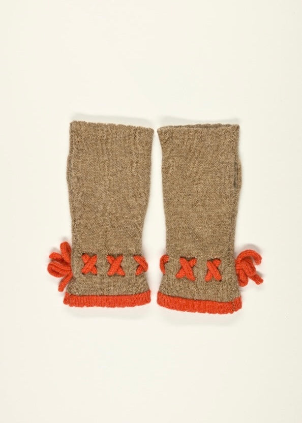 Pair of tan knitted arm warmers with orange decorative elements on a white background