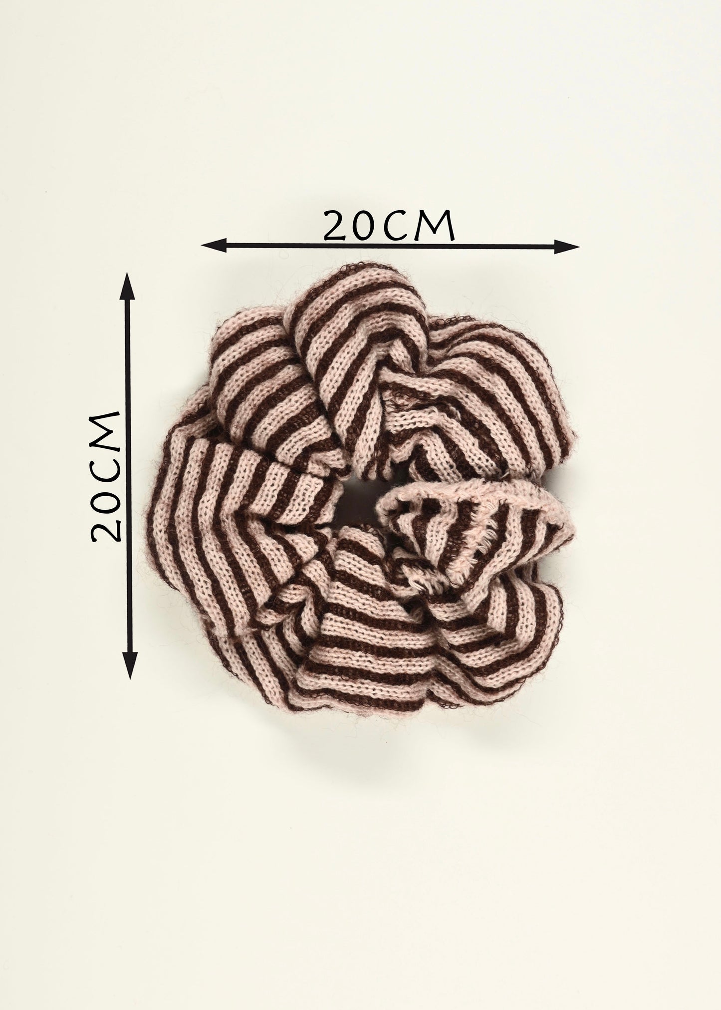 Knitted pink and plum striped scrunchie with dimensions labeled on a white background, 20cm L by 20cm W