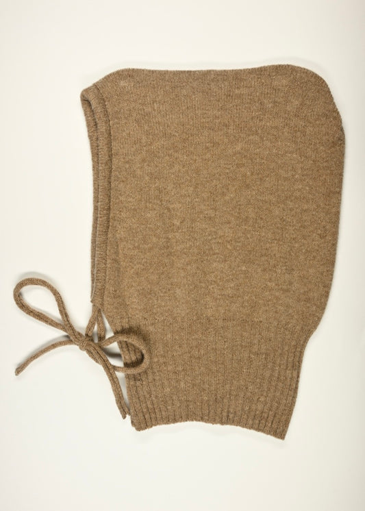 A flat lay of our cashmere knitted hood balaclava in tan on a white background 
